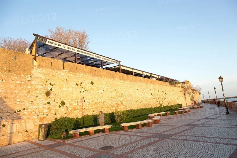 City walls of fortified medieval old town, Cidade Velha, from the waterfront city of Faro, Portugal, Europe