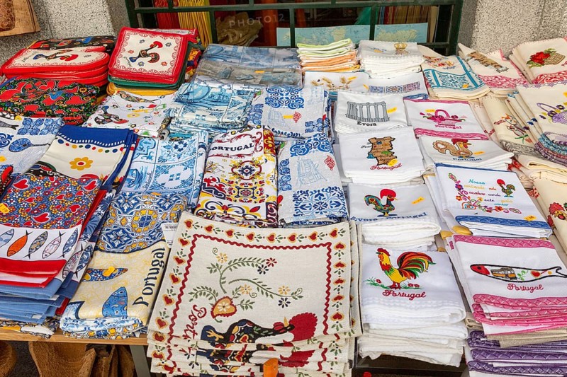 Display of tea towel textile souvenir products of butterflies and fish on sale, city of Evora, Alto Alentejo, Portugal, southern Europe, Europe
