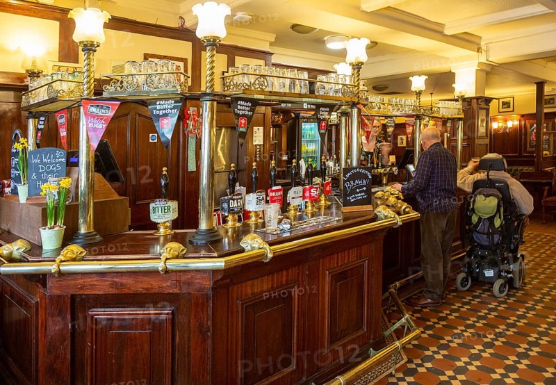 Interior of historic Goat Major pub in city centre of Cardiff, South Wales, UK, bar with Brains beers on sale