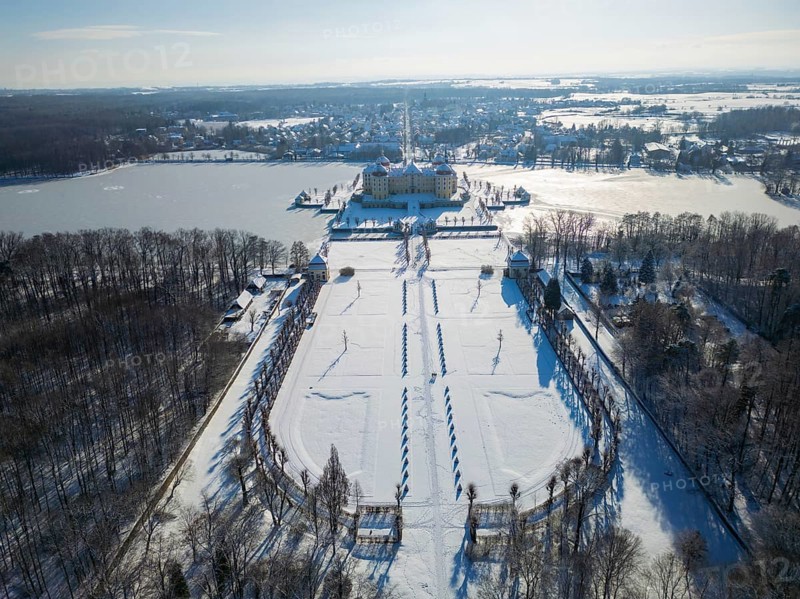 Moritzburg Castle on the castle island surrounded by the frozen castle pond, Moritzburg, Saxony, Germany, Europe