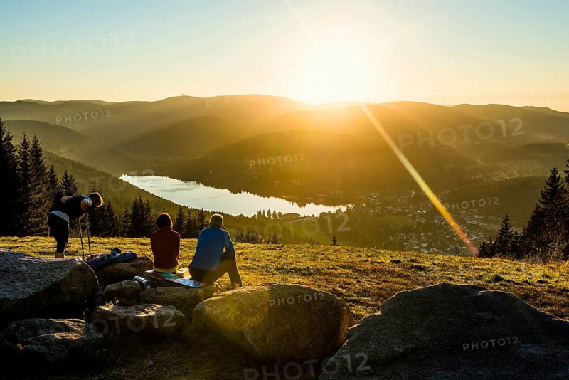 Hiking group, view from Hochfirst to Titisee and Feldberg, sunset, near Neustadt, Black Forest, Baden-Wuerttemberg, Germany, Europe