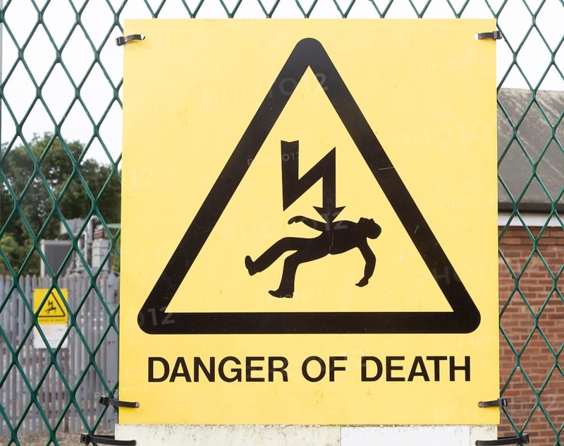 Close up sign Danger of Death at electricity sub station, Knodishall, Suffolk, England, UK