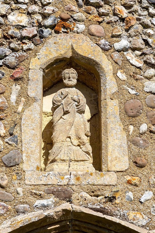 Church Holton, Suffolk, England, UK small statue of Saint Peter in porch niche