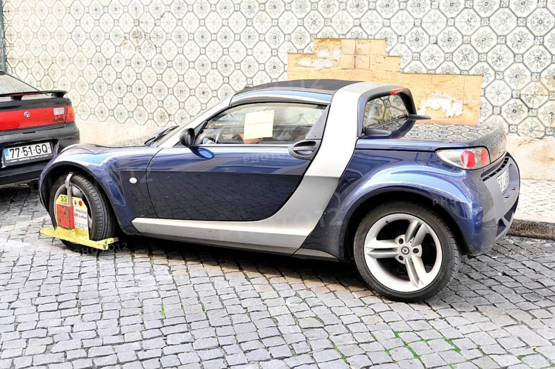 Car with police claw, Parking in no parking zone, Lisbon, Lisboa, Portugal, Europe