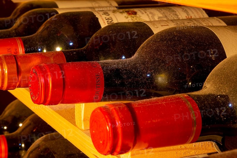 Wine cellar with red wine bottles (editorial)