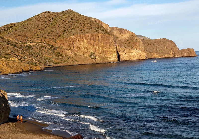 Man and woman holding hands walking on beach, Isleta del Moro, Cabo de Gata natural park, Almeria, Spain, Europe
