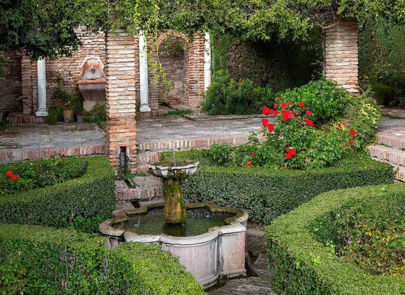 Water fountain in garden of historic Moorish palace Alcazaba, Malaga, Andalusia, Spain, Europe