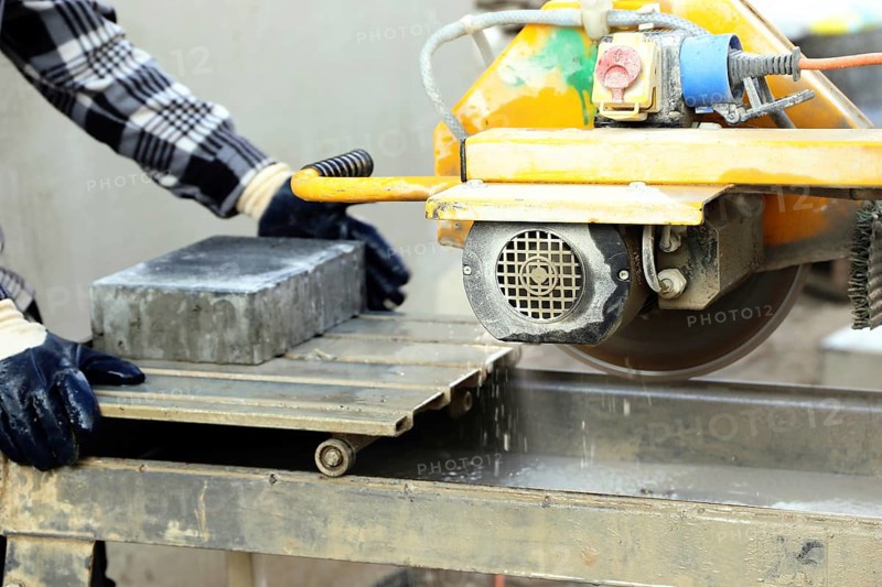 Bricklayer at the stone cutter
