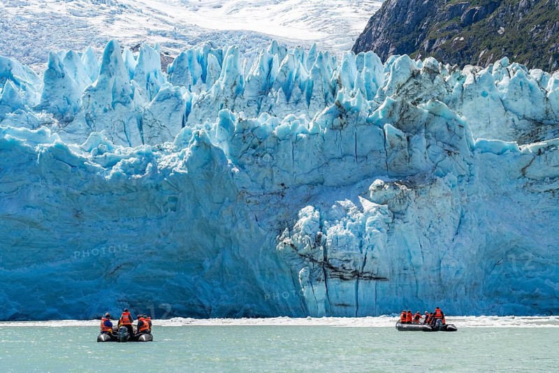 Passengers of the cruise ship Stella Australis in rubber dinghies in front of the ice of the Porter Glacier, Alberto de Agostini National Park, Avenue of the Glaciers, Chilean Arctic, Patagonia, Chile, South America