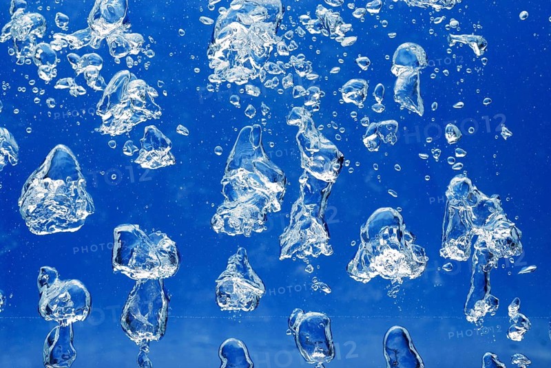 Bright Air bubbles, blue background in an aquarium