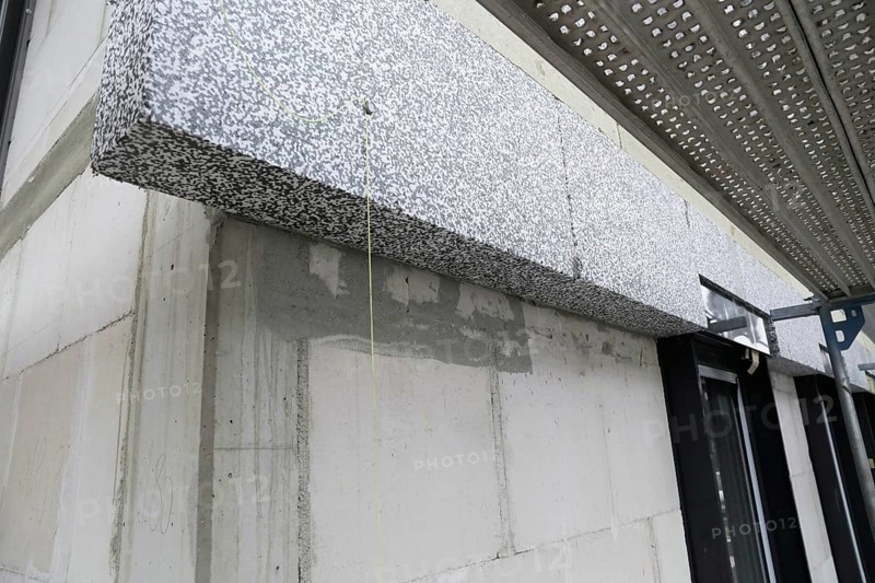 Thermal insulation of a house facade