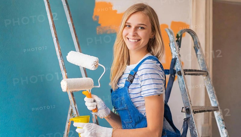 AI generated, woman, woman, a young girl paints a wall with new paint, blue, light blue, blue, light blue, renovation of old flat, paint roller, ladder, paint, 20, 25, years, a, a person, daughter, student, pastime, family, girl, smiles, smiling, fun at work, laughing, laughing, laughing, dungarees, jeans