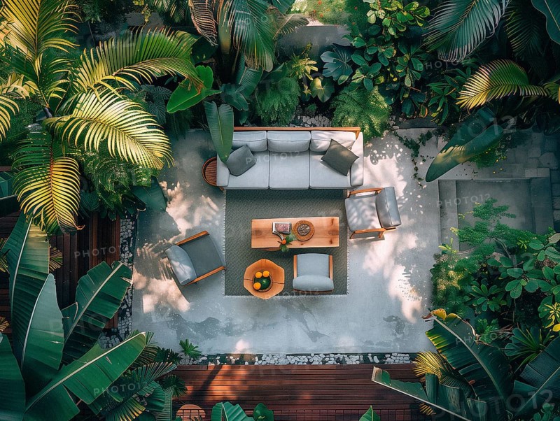 A serene courtyard with tropical plants, stone tiles, and comfortable outdoor furniture bathed in sunlight, Playa del Carmen beach in Mexico, AI generated