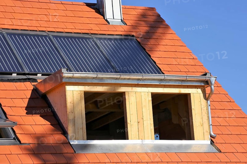 Roofer working on a new dormer window