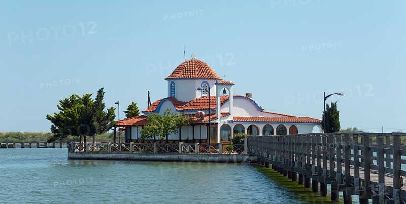 Small church with tiled roof on the water's edge with connection via a bridge, Monastery of St Nicholas, Monastery of Agios Nikolaos, Agiou Nikolaou, Vistonidas Burma Lagoon, Porto Lagos, Xanthi, Eastern Macedonia and Thrace, Greece, Europe