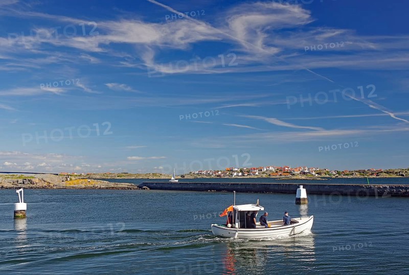 Small fishing boat in front of archipelago islands, summer, Oeckeroe, Gothenburg, Sweden, Europe