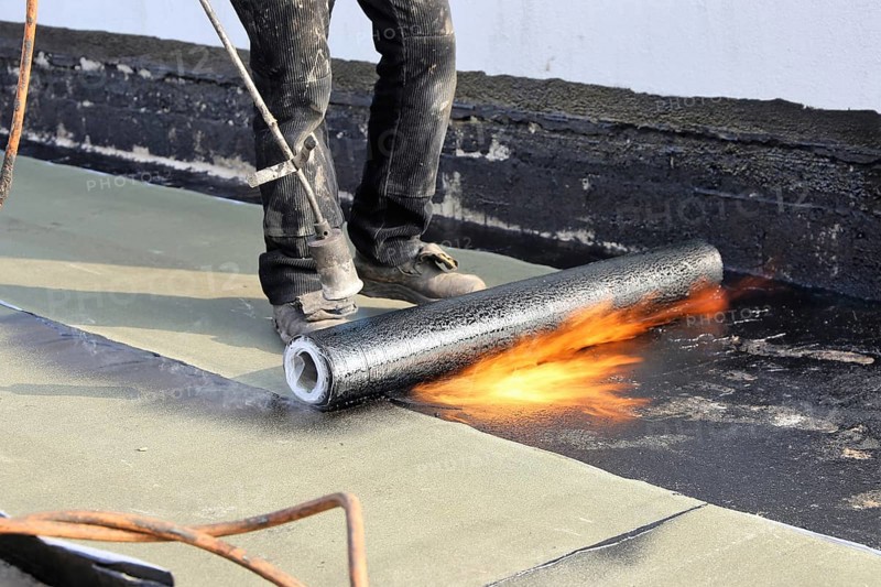 Professional flat roof waterproofing with bitumen welding membranes