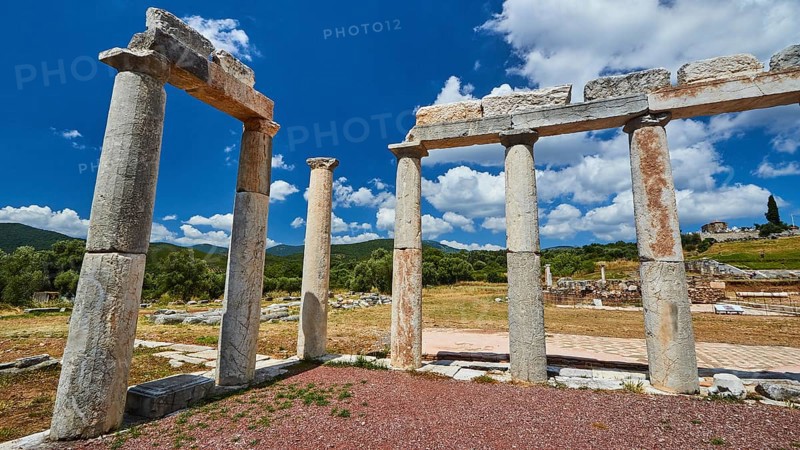 The remains of an ancient columned structure on a sunny day, Stoa of the Agora, Archaeological site, Ancient Messene, capital of Messinia, Messini, Peloponnese, Greece, Europe