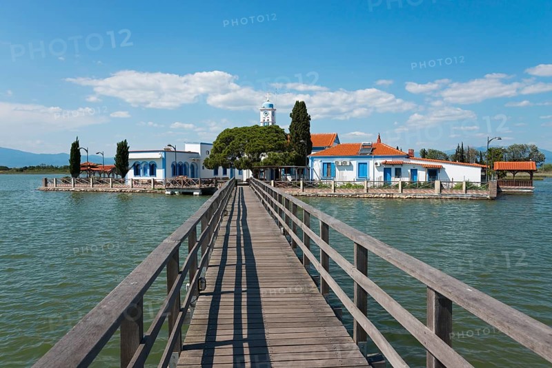 Monastery complex with church at the end of a bridge over calm water, Monastery of St Nicholas, Monastery of Agios Nikolaos, Agiou Nikolaou, Vistonidas Burma Lagoon, Porto Lagos, Xanthi, Eastern Macedonia and Thrace, Greece, Europe