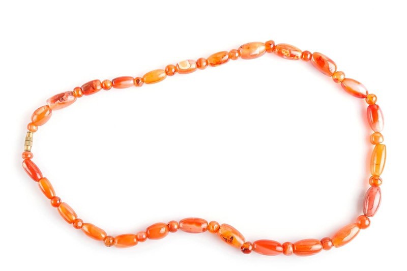 Colored onyx beads isolated on white background. top view, close up