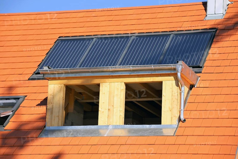 Roofer working on a new dormer window