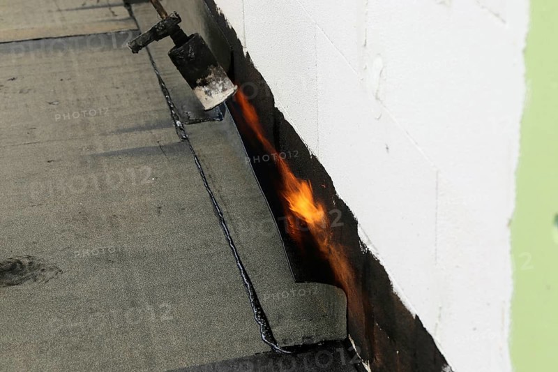 Professional flat roof waterproofing with bitumen welding membranes