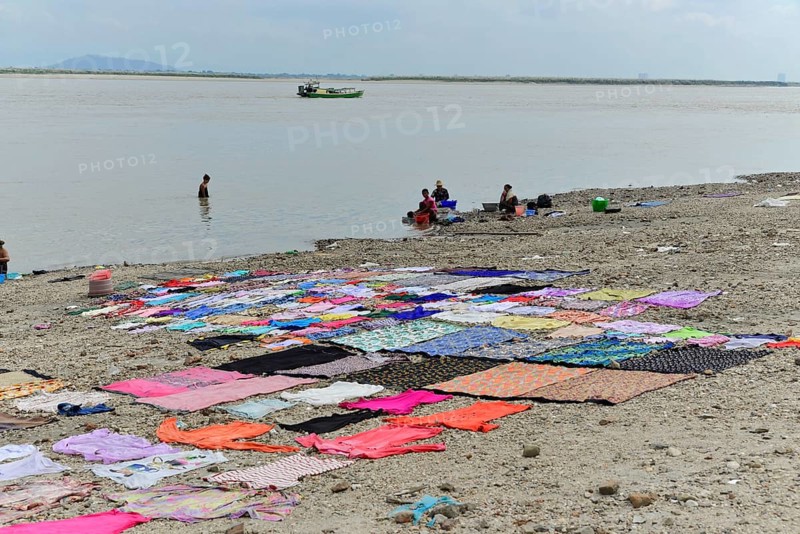 Washing clothes in the Irrawaddy, Myanmar, Asia