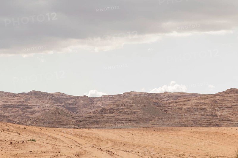 Desert, red mountains, rocks and cloudy sky. Egypt, color canyon, the Sinai Peninsula, Dahab