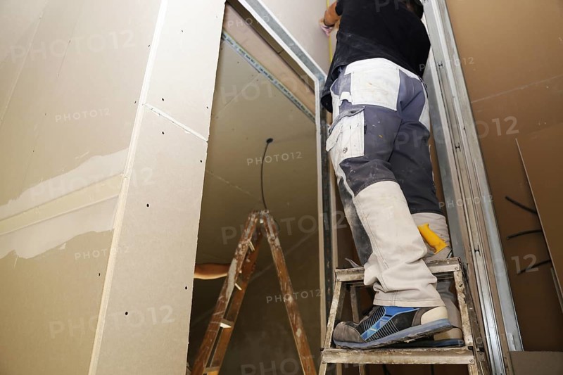 Craftsmen doing drywall work