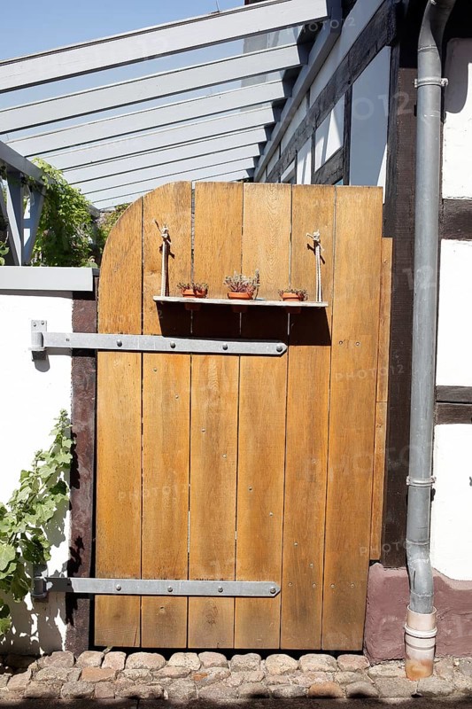 Old brown wooden gate at a garden, Hoya, Lower Saxony, Germany, Europe