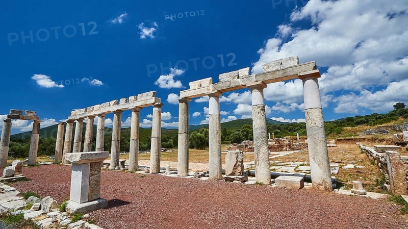 Row of ancient columns under a bright blue sky on an archaeological site, Stoa of the Agora, Archaeological site, Ancient Messene, capital of Messinia, Messini, Peloponnese, Greece, Europe