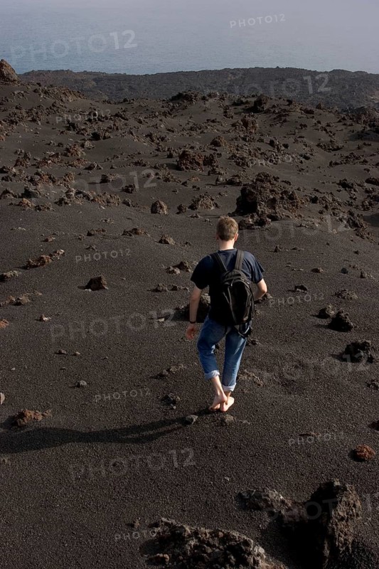Walking barefooted over volcanic sand of the Teneguia volcano, La Palma, Canary Islands, Spain, Europe
