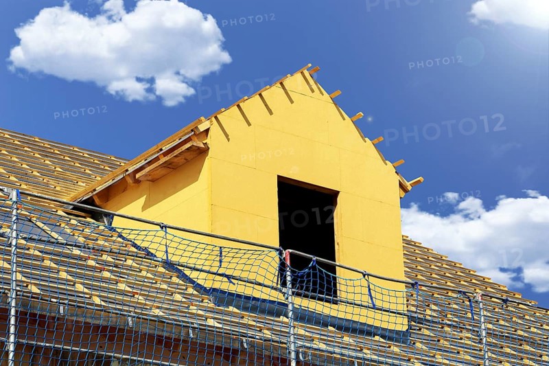 Roofer working on a new dormer window