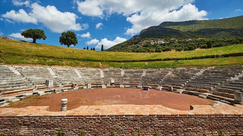 Ruins of an ancient theatre with seating steps standing out against the blue sky, Ancient theatre, Archaeological site, Ancient Messene, Capital of Messinia, Messini, Peloponnese, Greece, Europe