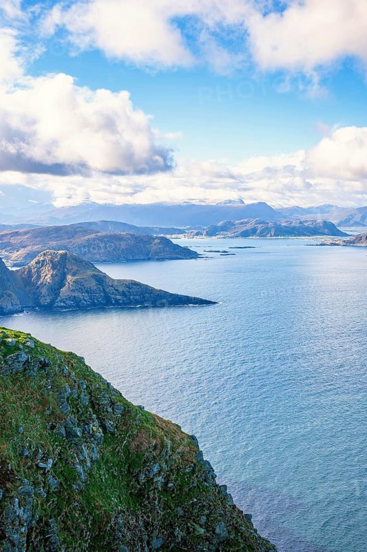 View of a fjord landscape with a rocky coast on the Norwegian coast, Runde, Heroy, Norway, Europe