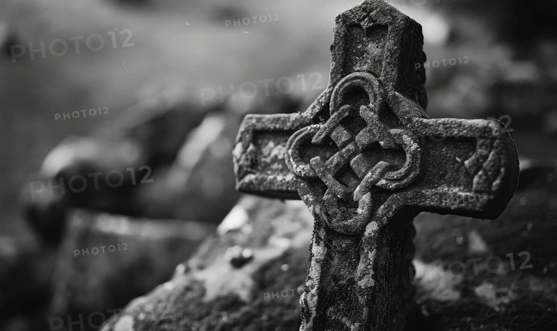 Black and white image of a Celtic cross on a grave in a cemetery, copy space. AI generated