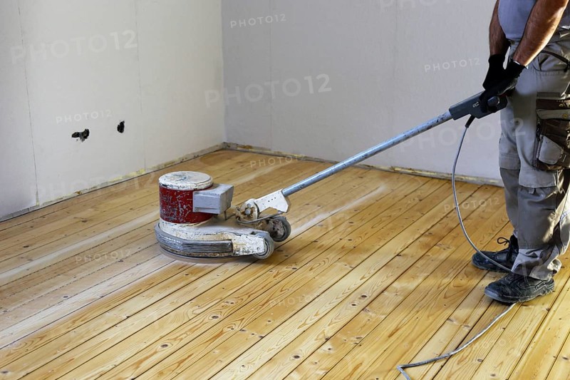 A parquet floor is sanded and oiled