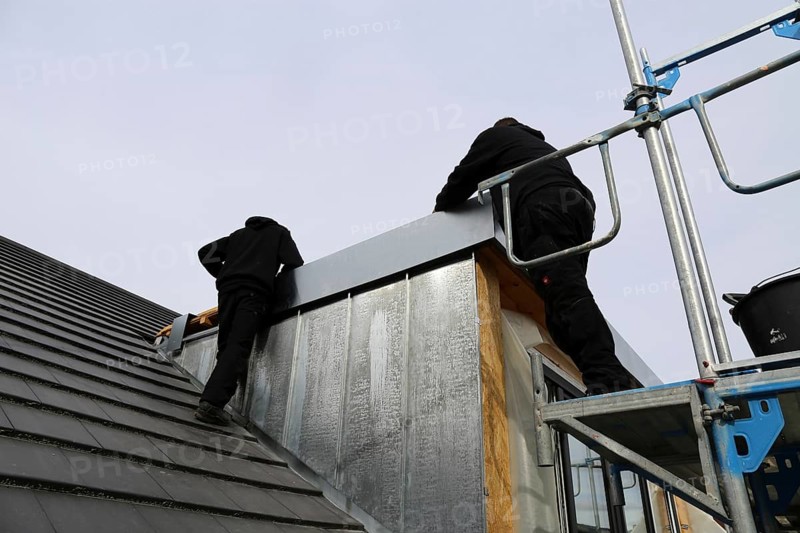 Roofer working on a new dormer window