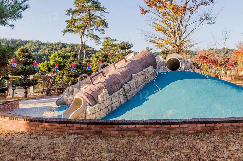 Playground slides in wilderness park in Pohang, South Korea, Asia