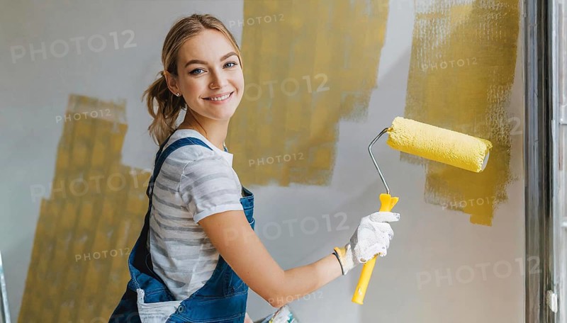 AI generated, woman, woman, a young girl paints a wall with new paint, yellow, yellow, renovation of old flat, paint roller, ladder, paint, 20, 25, years, one, one person, daughter, student, pastime, family, girl, smiling, smiling, fun at work, laughing, laughing, laughing, dungarees, jeans