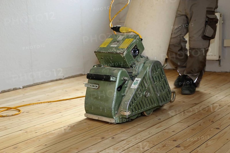 A parquet floor is sanded and oiled