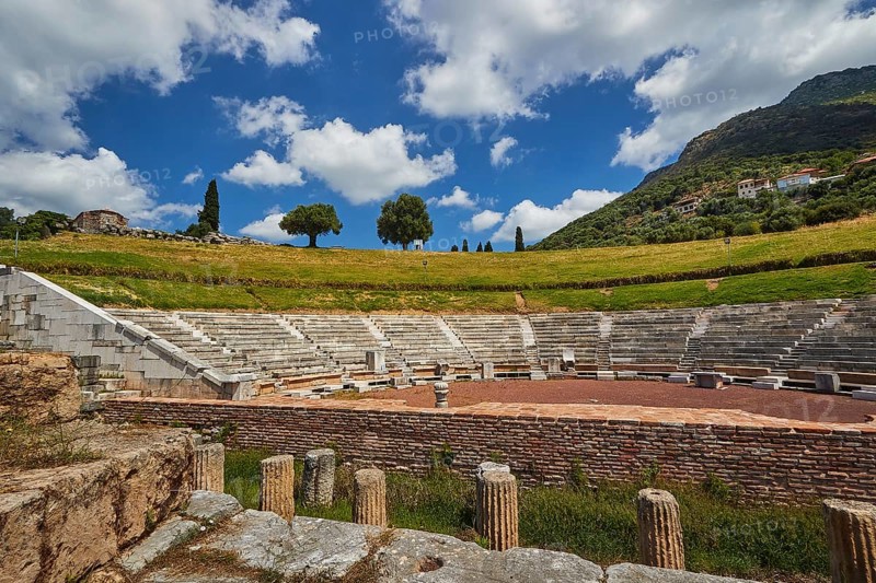 View of an amphitheatre with surrounding trees and mountains in the background, Ancient Theatre, Archaeological Site, Ancient Messene, Capital of Messinia, Messini, Peloponnese, Greece, Europe