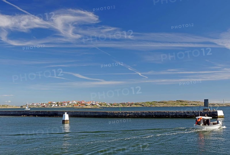 Small fishing boat in front of archipelago islands, summer, Oeckeroe, Gothenburg, Sweden, Europe