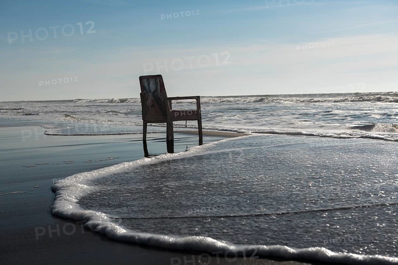 Upholstered chair washed up on the North Sea shore, flotsam, Oksbol, Region Syddanmark, Denmark, Europe