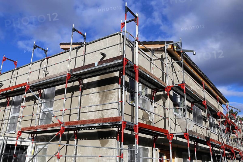 New building with completed basic rendering of the exterior facade