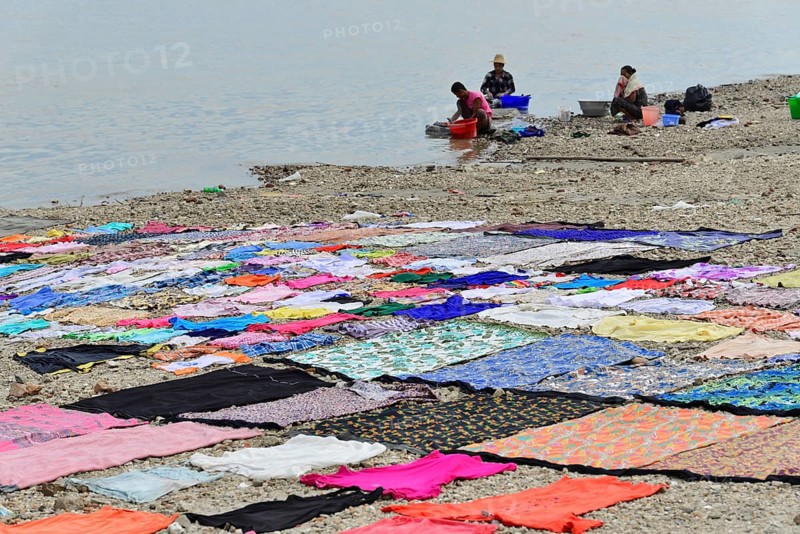 Washing clothes in the Irrawaddy, Myanmar, Asia