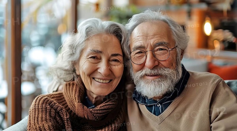 An elderly couple smiling warmly, dressed in cozy sweaters, radiating affection, ai generated, AI generated