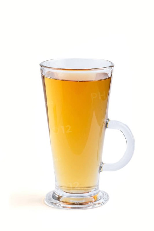Glass of green grape juice isolated on white background. Morninig, spring, healthy drink concept. Side view, close up