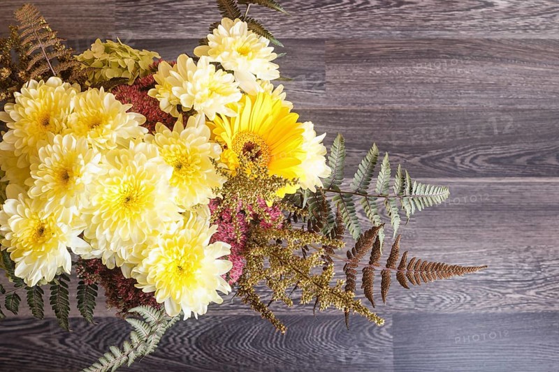 Bouquet of gerbera and chrysanthemum on a wooden background. floristic composition. copy space