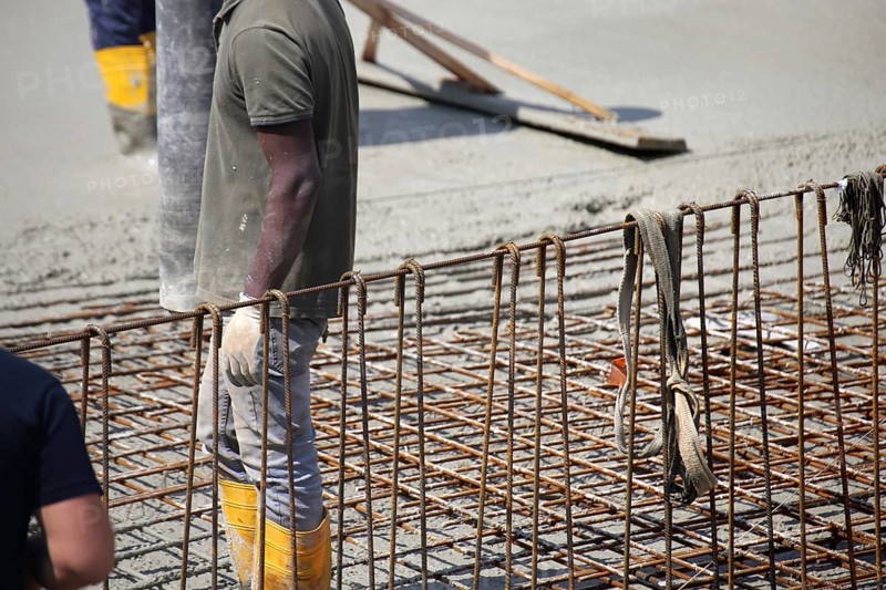 Concreting a floor slab with ready-mixed concrete on the construction site of a residential building